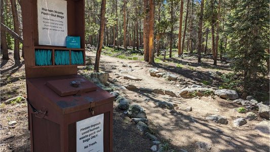 Trailhead kiosk with human waste pack out bags 